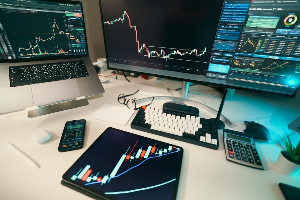 A modern trading desk with screens displaying financial charts and graphs, showcasing a digital analysis setup.
